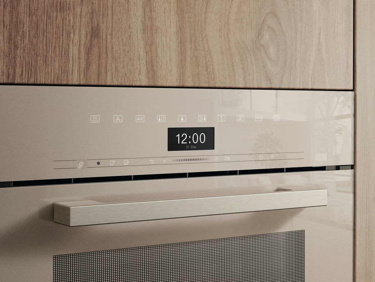 Close-up of the control panel and handle of the Miele DGC 7440 HC Pro VitroLine steam oven in pearl beige.