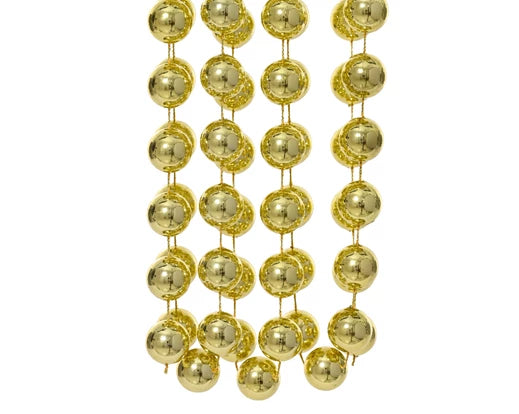 Close-up of shiny light gold polystyrene bead garland strands with 1.4cm diameter beads.