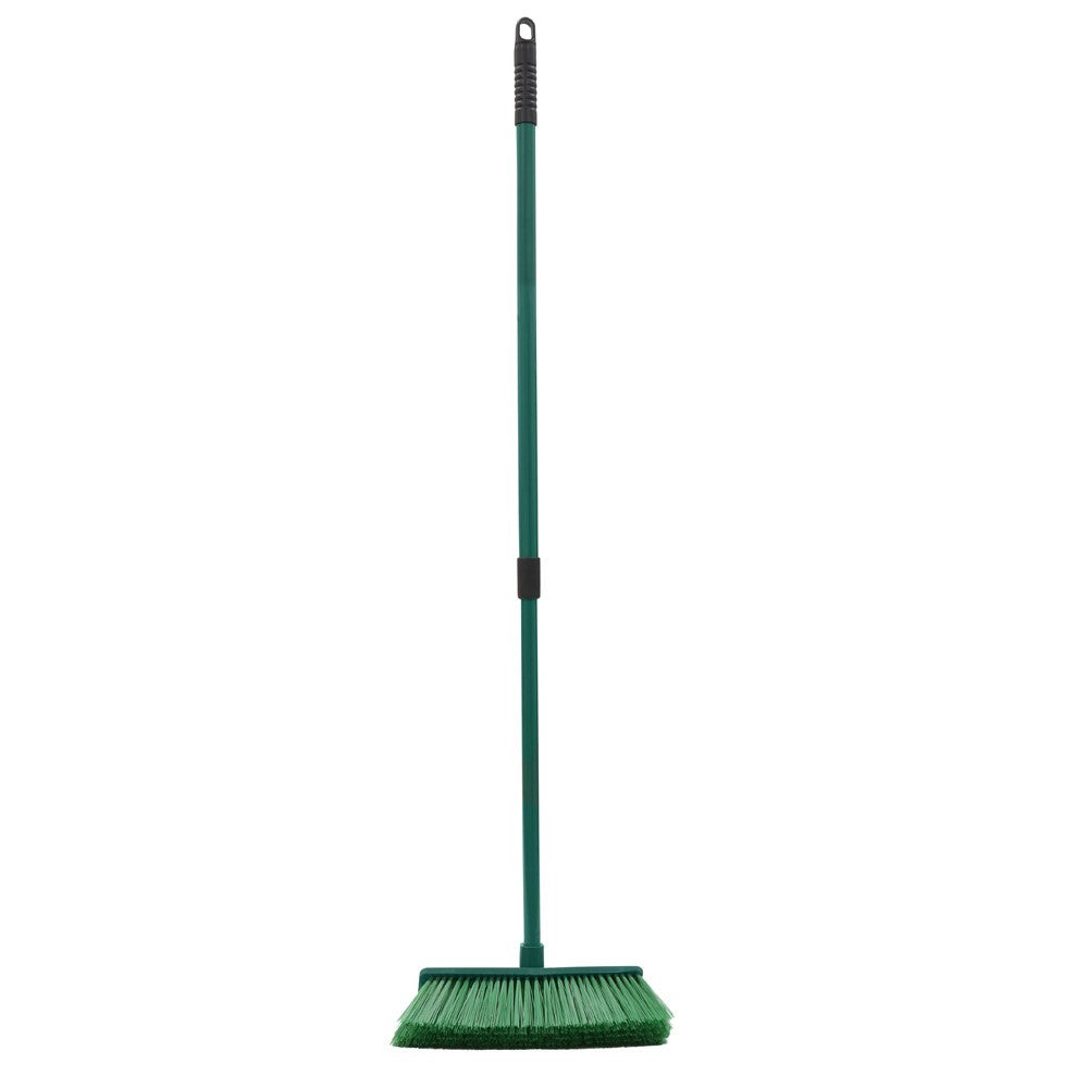 The Gardener hard bristle broom with green extendable handle and black grip on white background