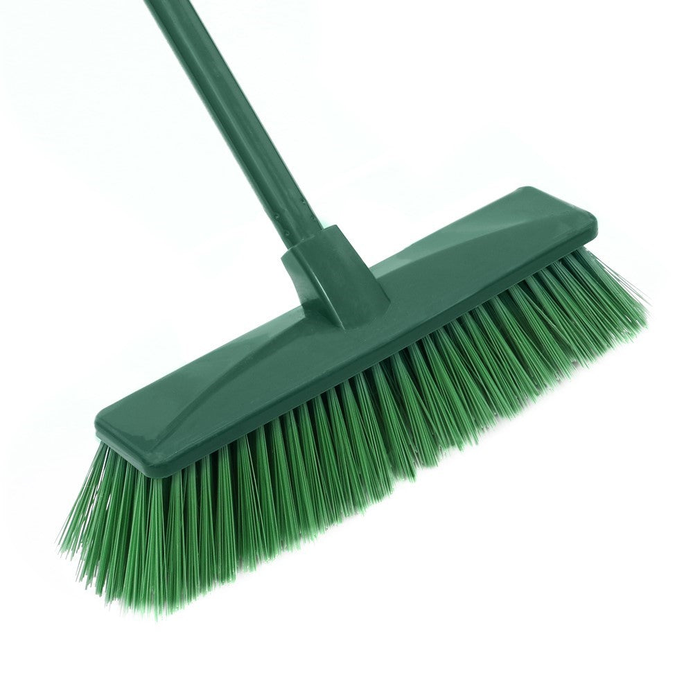 Close-up of The Gardener hard bristle broom head with green bristles and green extendable handle