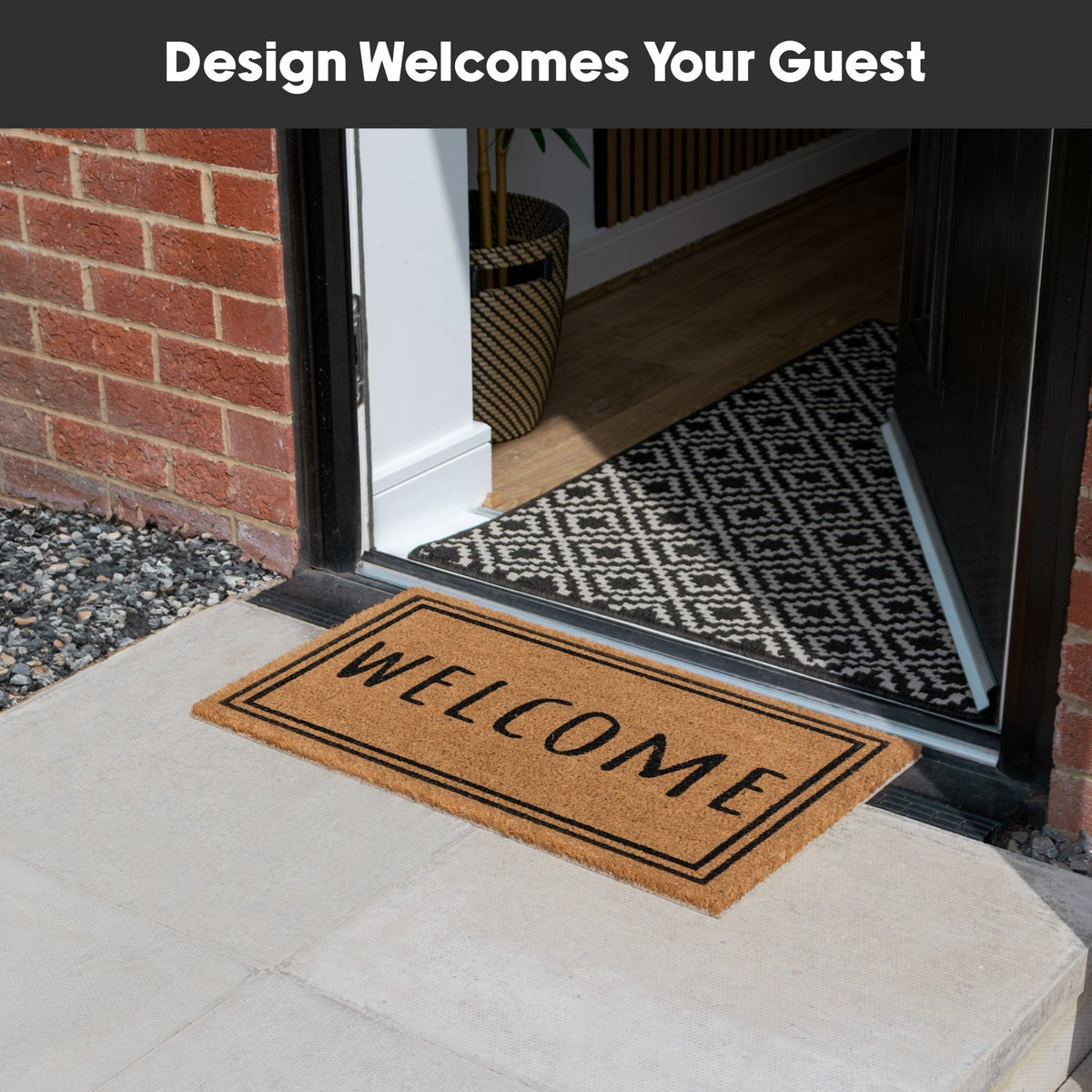 Latex coir doormat with "WELCOME" text and border placed outside an open front door on a stone porch.