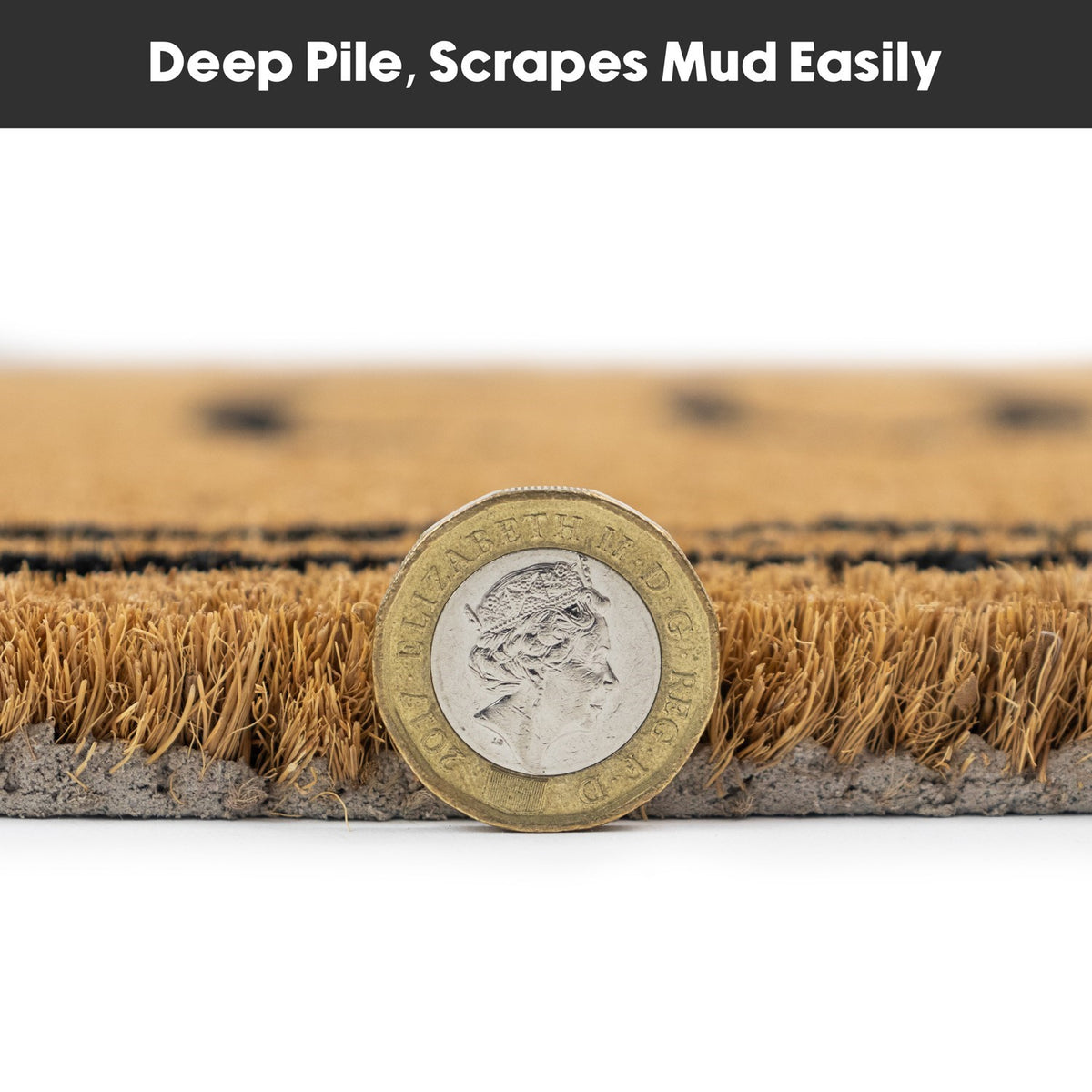 Close-up side view of latex-backed coir doormat with a coin showing pile height and texture.
