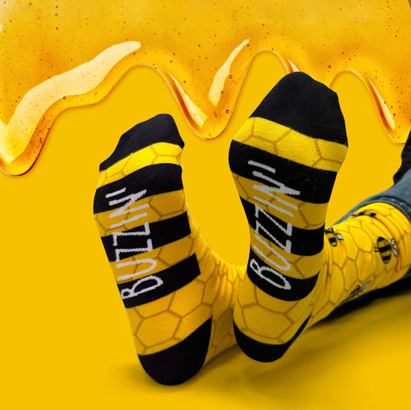 BUZZIN' 8-12 bee-themed socks by Rachel Rothwell, 2023 design winner, available at Keans Claremorris.