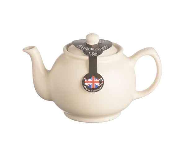 Matt Cream 6 Cup Teapot with rounded body, curved spout, and handle, shown with label on lid.