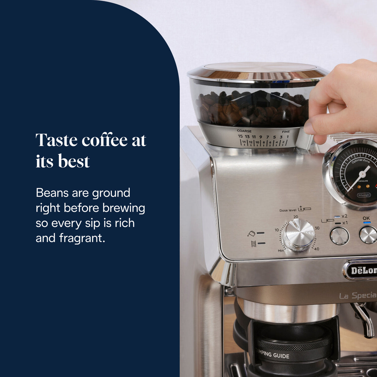 Hand adjusting grind size dial on DeLonghi La Specialista Arte Evo espresso machine with visible coffee beans.