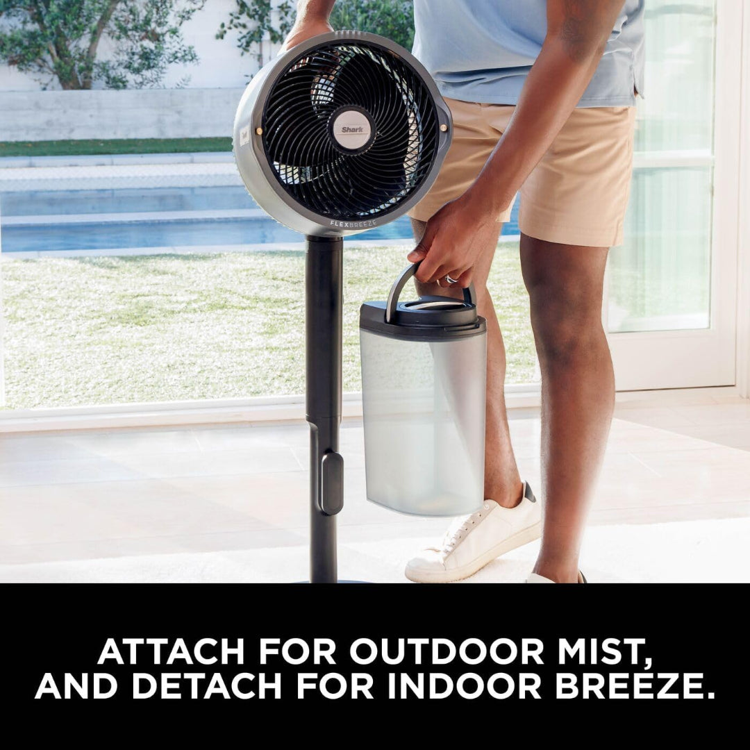 Person attaching a detachable water tank to the Shark FlexBreeze Pro Mist fan for outdoor misting.