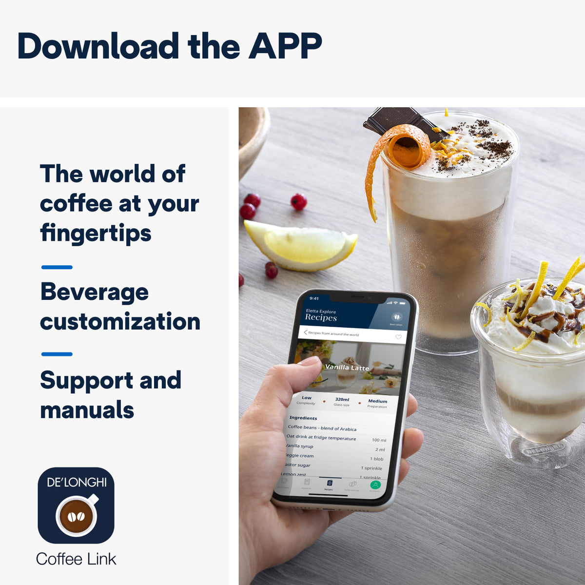 Hand holding phone displaying DeLonghi Eletta Explore app with two decorated coffee drinks on table nearby.