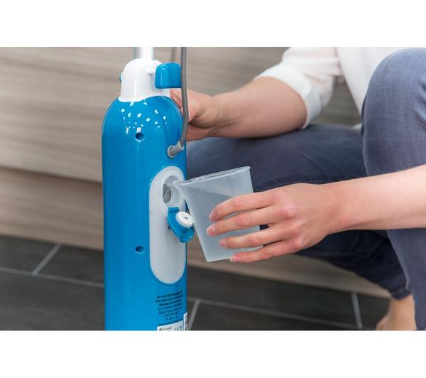 Close-up of a person filling the water tank of a blue Russell Hobbs Steam and Clean Steam Mop RHSM1001G.