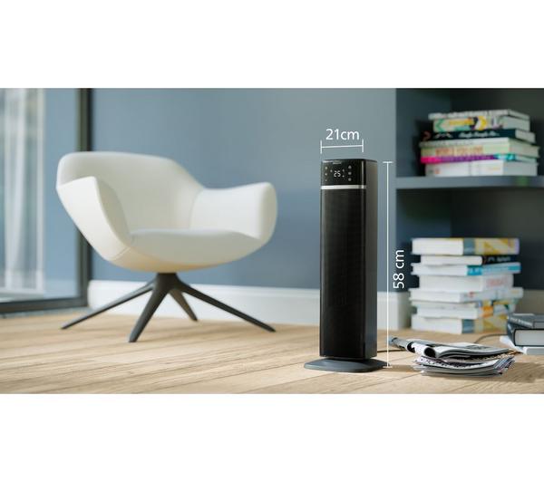 Philips Smart Tower Heater 5000 Series in dark grey standing on wooden floor next to a white chair and books.