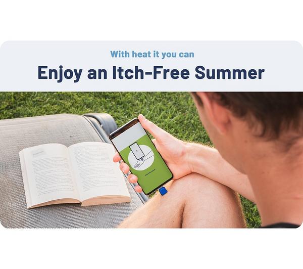 Person holding a phone with Heat-It Classic USB C connector insect bite healer attached outdoors by a book on a lounge chair