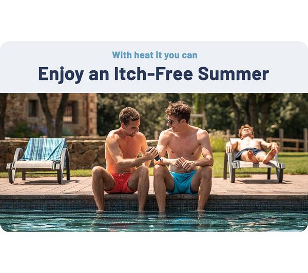Two men in swim trunks sitting by a pool, one using the Heat-It Classic USB C insect bite healer on the other's arm