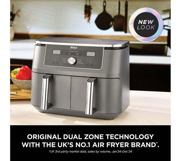 Ninja MAX 6-in-1 Dual Zone Air Fryer in dark grey with two handles and digital control panel on kitchen counter.