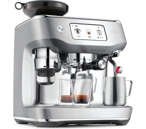Sage Oracle Dual Boiler stainless steel espresso machine brewing two shots with milk frothing jug and touchscreen display.