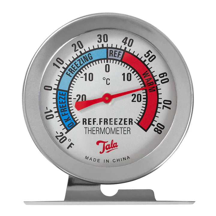 Tala fridge/freezer thermometer with metal frame, color-coded temperature zones, and red needle at 20°C.