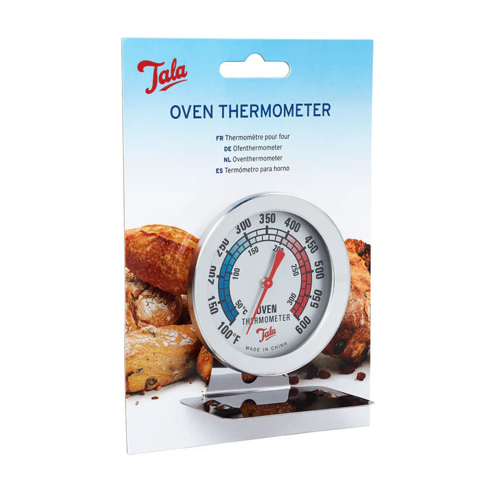 Tala oven thermometer with a round dial showing temperature in Fahrenheit and Celsius on a stand, in packaging.