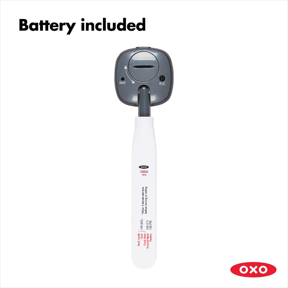 Oxo thermometer showing the back with battery compartment and temperature unit button on white handle