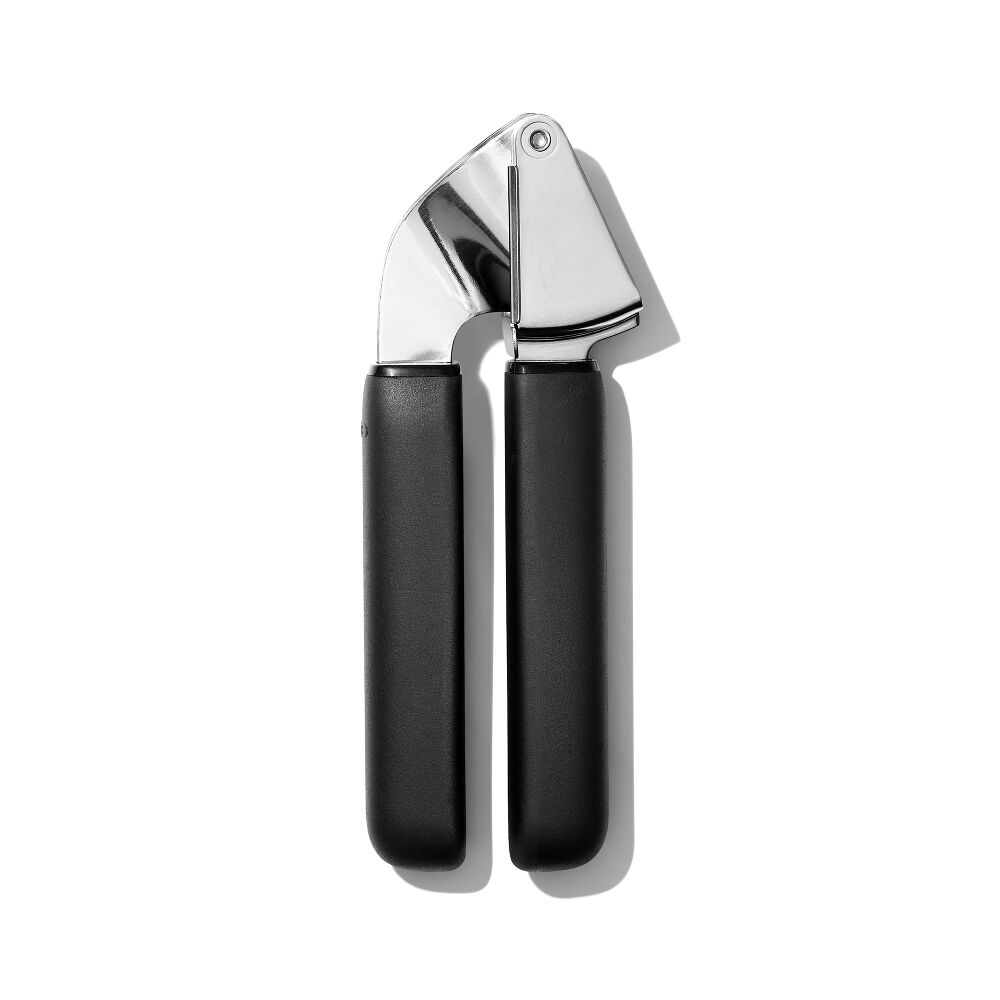 Oxo Good Grips garlic press with stainless steel head and black soft-grip handles on white background