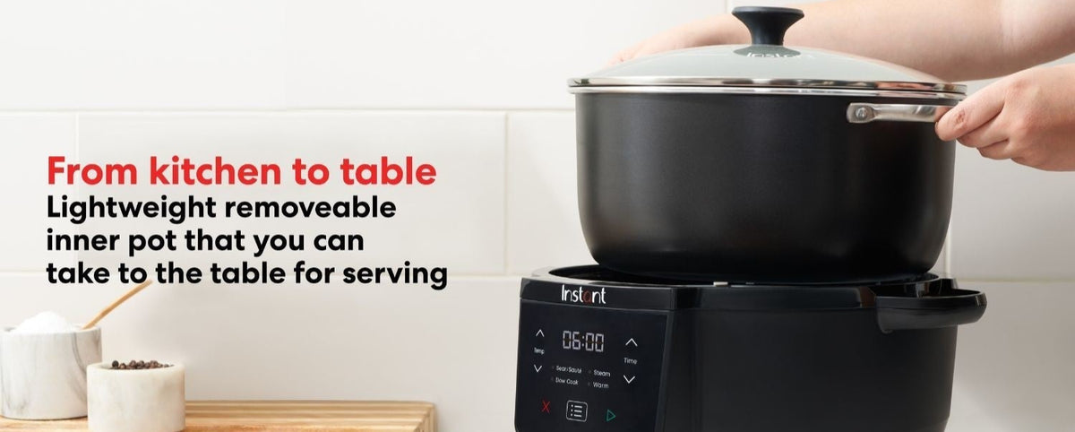 Hands lifting the lightweight removable inner pot with lid from the Instant Pot Superior Slow Cooker
