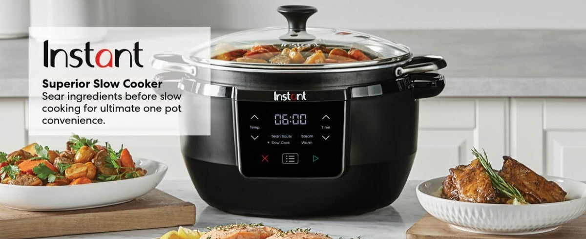 Instant Pot Superior Slow Cooker with digital display, glass lid, and cooked food inside on a kitchen counter.
