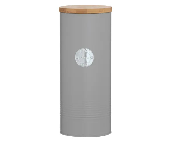 Tall cylindrical grey pasta jar with a wooden lid and a small round metal label on the front