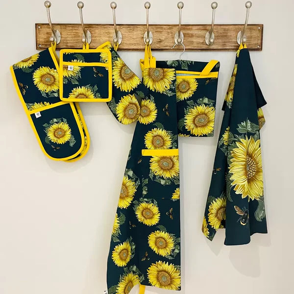 RHS Sunflower Adult Apron in Navy with floral design, durable fabric – available at Keans Claremorris.