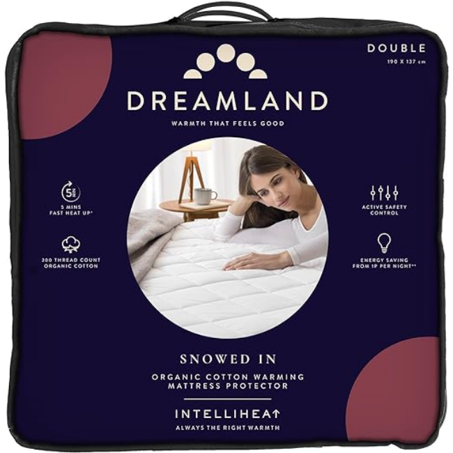 Dreamland Snowed In organic cotton warming mattress protector packaging with woman resting on bed image