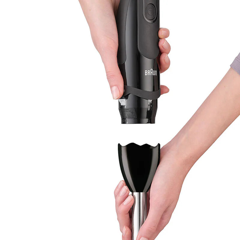 Hands detaching the black blending shaft from the Braun Hand Blender MultiQuick 5 MQ5237BK body.