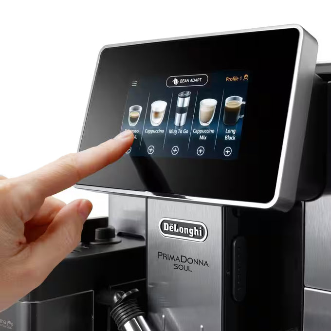 Person interacting with a De'Longhi PrimaDonna Soul coffee machine's touch screen.