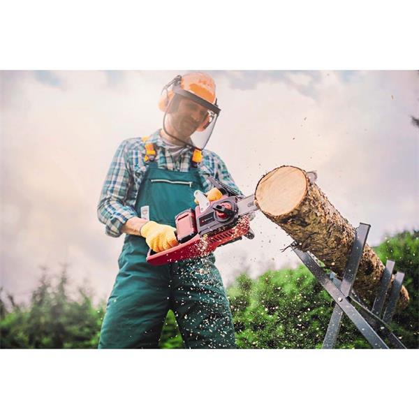 Man wearing protective gear using Einhell Power X-Change 36V 35CM cordless chainsaw to cut a log outdoors