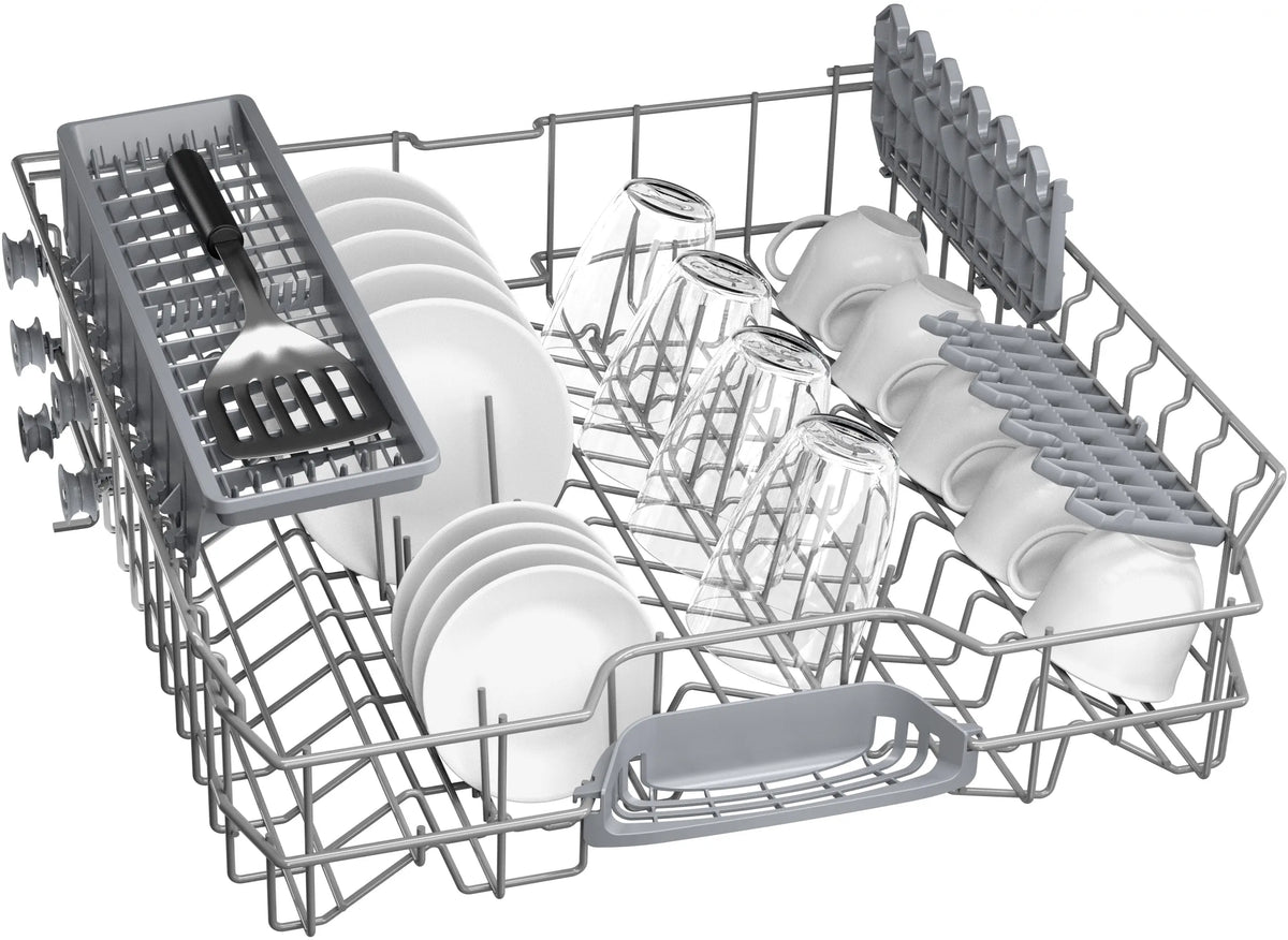 Top rack of Bosch Series 4 dishwasher loaded with plates, glasses, mugs, and a spatula in the cutlery tray.
