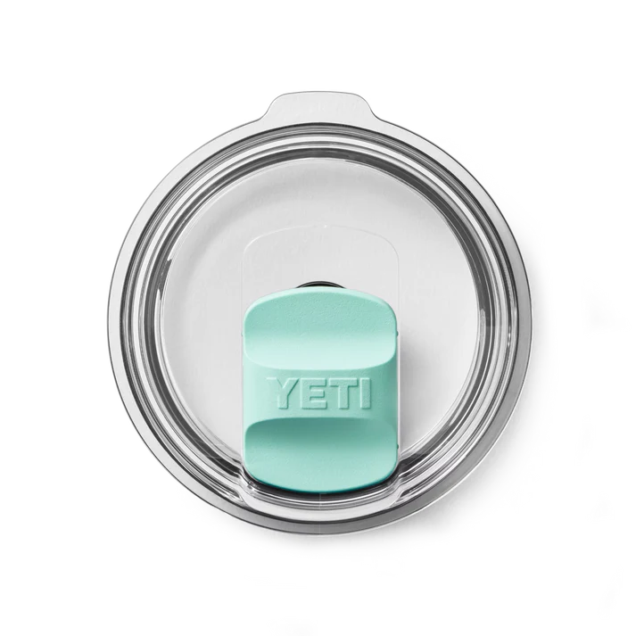 Clear round tumbler lid with seafoam-colored YETI slider in the center, part of Magslider Pack