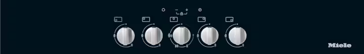 Close-up of Miele KM 3034-1 gas hob control panel with five silver knobs on black surface and Miele logo.