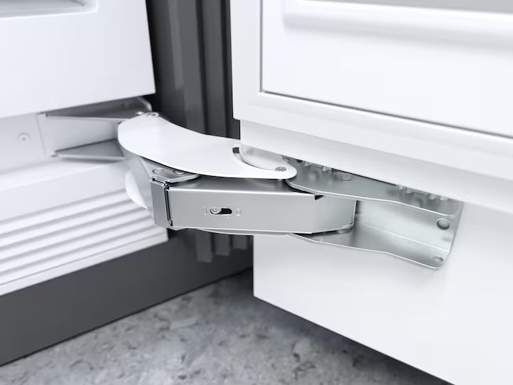 Close-up of the metal hinge mechanism on the Miele K 2902 Vi 213cm Built-In Fridge MasterFresh WiFi door.
