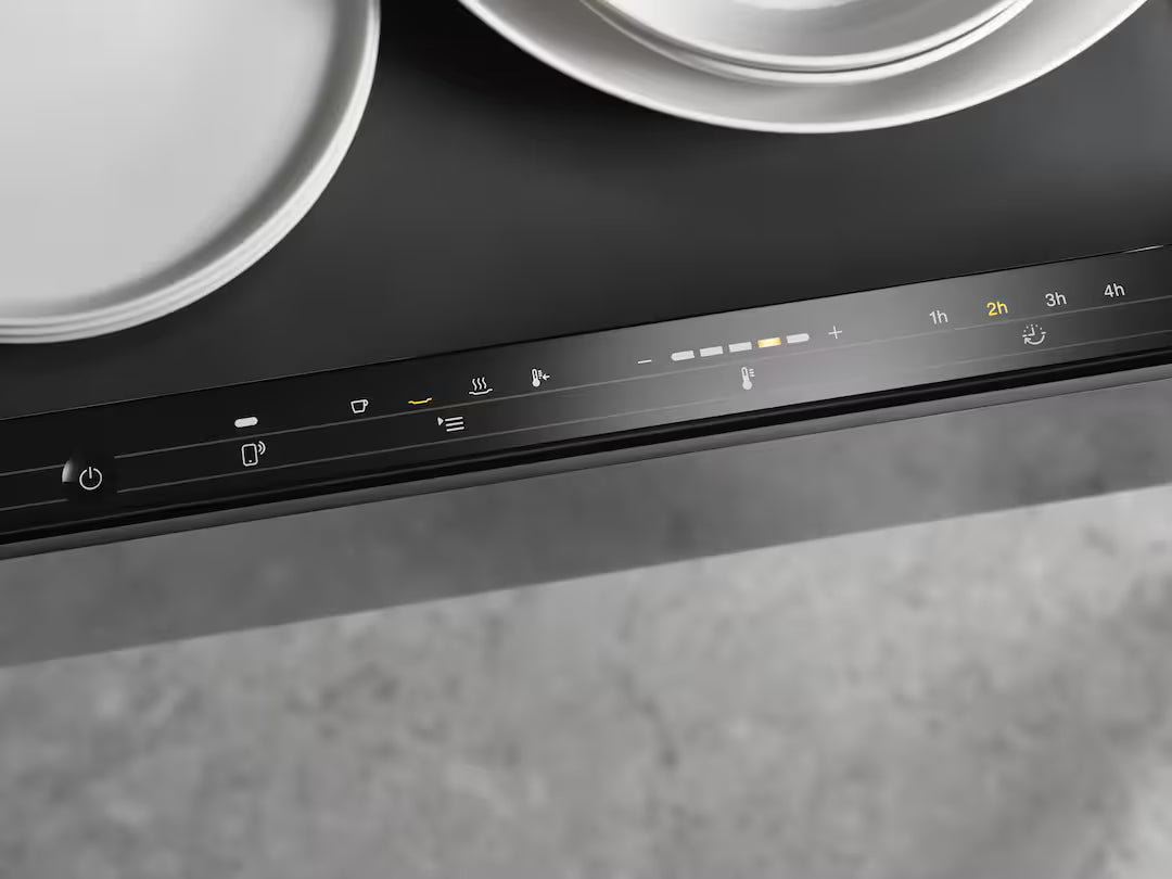Close-up of the Miele ESW 7020 warming drawer control panel with illuminated touch buttons in graphite grey.