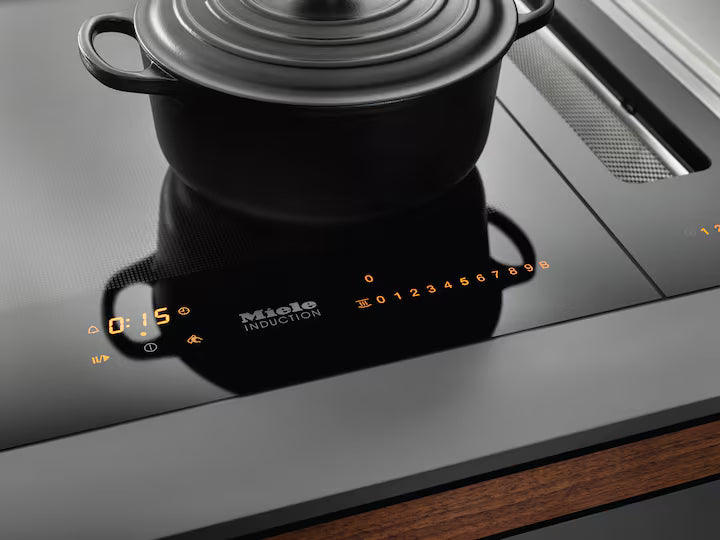 Miele CS 7612 FL SmartLine PowerFlex induction hob with digital controls and a black pot on top