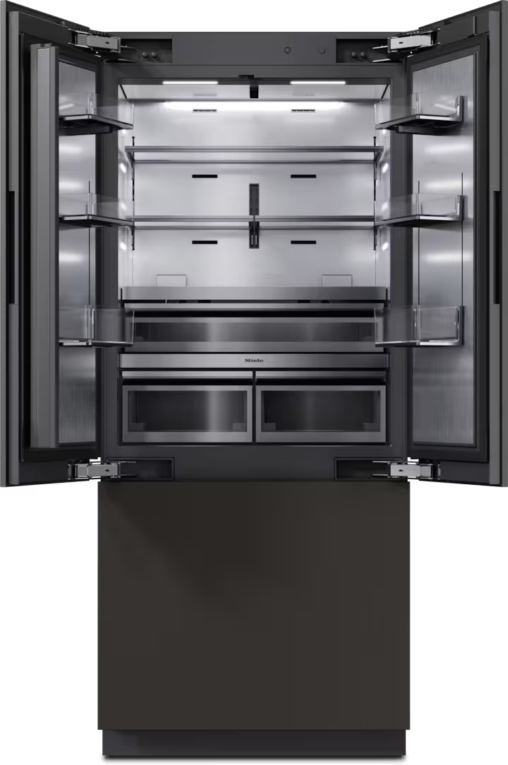 Miele KFMC 3844 FD French door fridge freezer with open doors showing empty shelves and drawers inside