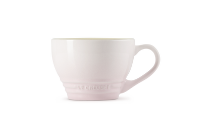 Le Creuset Grang Mug in shell pink with a smooth finish and embossed logo on the base.
