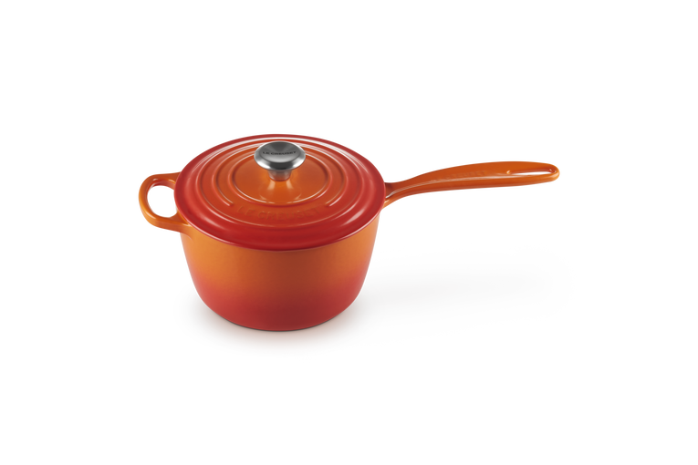 Le Creuset 20cm Volcanic orange saucepan with lid and long handle, shown at slight angle on white background