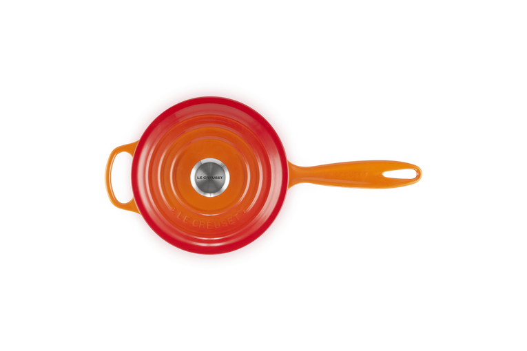 Le Creuset 20cm Volcanic saucepan shown from top with lid and long handle in orange-red color.
