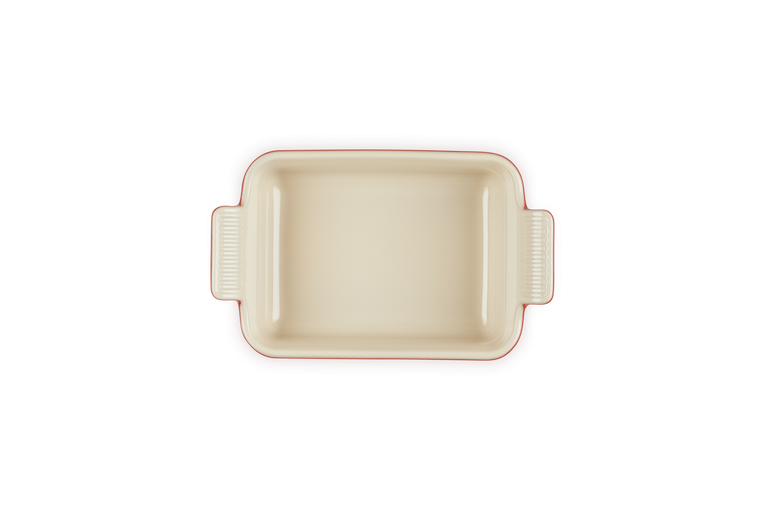 Le Creuset Heritage rectangular stoneware dish in cream, top-down view showing handles