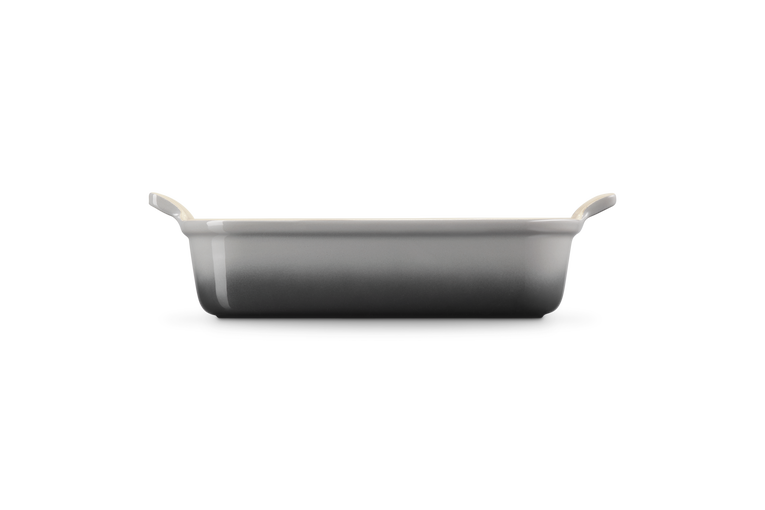 Le Creuset Stoneware Heritage rectangular dish in flint, side view showing handles and gradient finish.