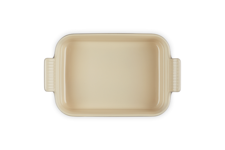 Le Creuset rectangular stoneware dish in flint, top view showing handles and smooth interior.