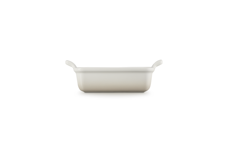 Le Creuset Stoneware Heritage rectangular dish in meringue, side view showing handles and smooth finish