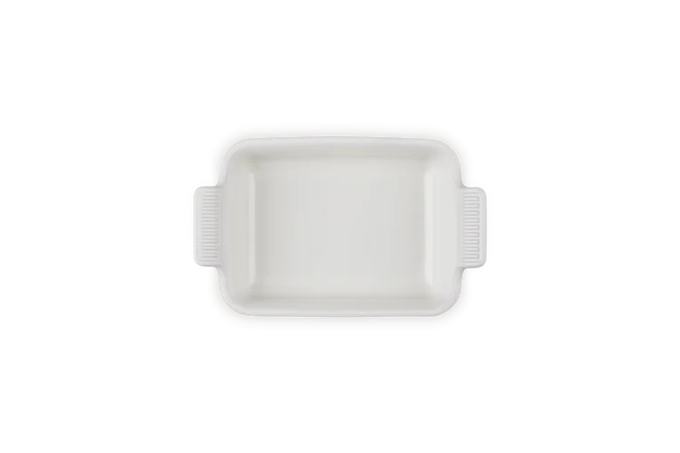 Le Creuset Stoneware Heritage rectangular dish in meringue, top view showing handles and smooth interior.