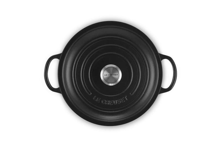 Top view of a matte black 22cm Signature Round Stew Pot with handles and metal knob lid.