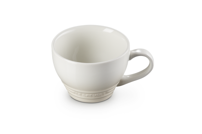 Le Creuset Grand Mug 400ml in meringue color, shown angled with handle visible on white background.
