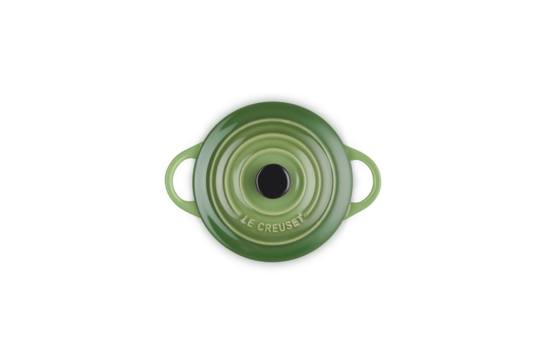 Le Creuset Petite Round Casserole in green with bamboo knob, top view showing lid and handles.