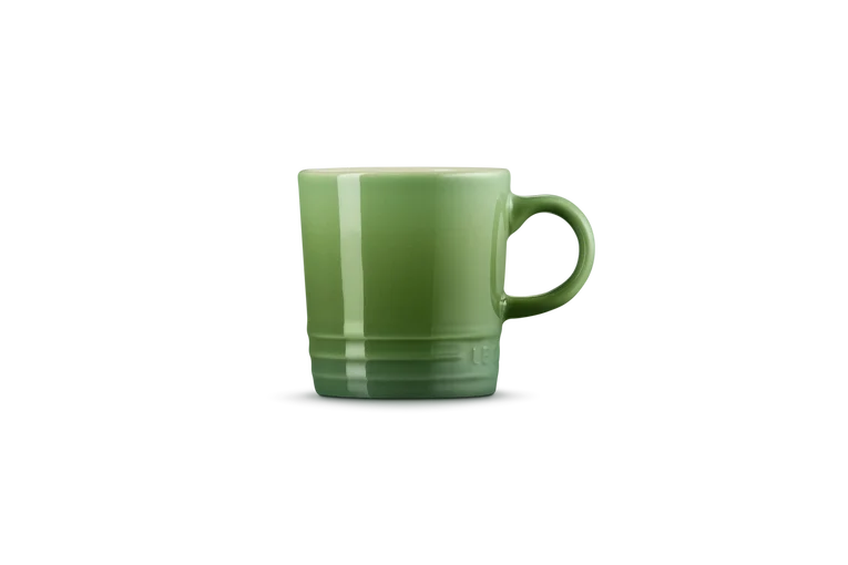 Le Creuset Stoneware Espresso Mug in bamboo green, side view showing handle and glossy finish.