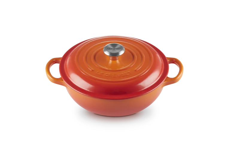 Signature Round Stew Pot 22cm in volcanic orange with lid and side handles on black background
