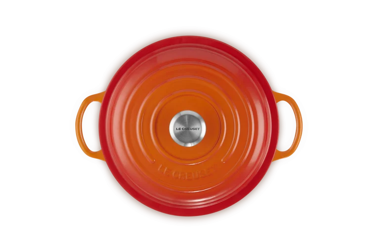 Top view of a 22cm Signature Round Stew Pot in volcanic orange with handles and metal knob lid.